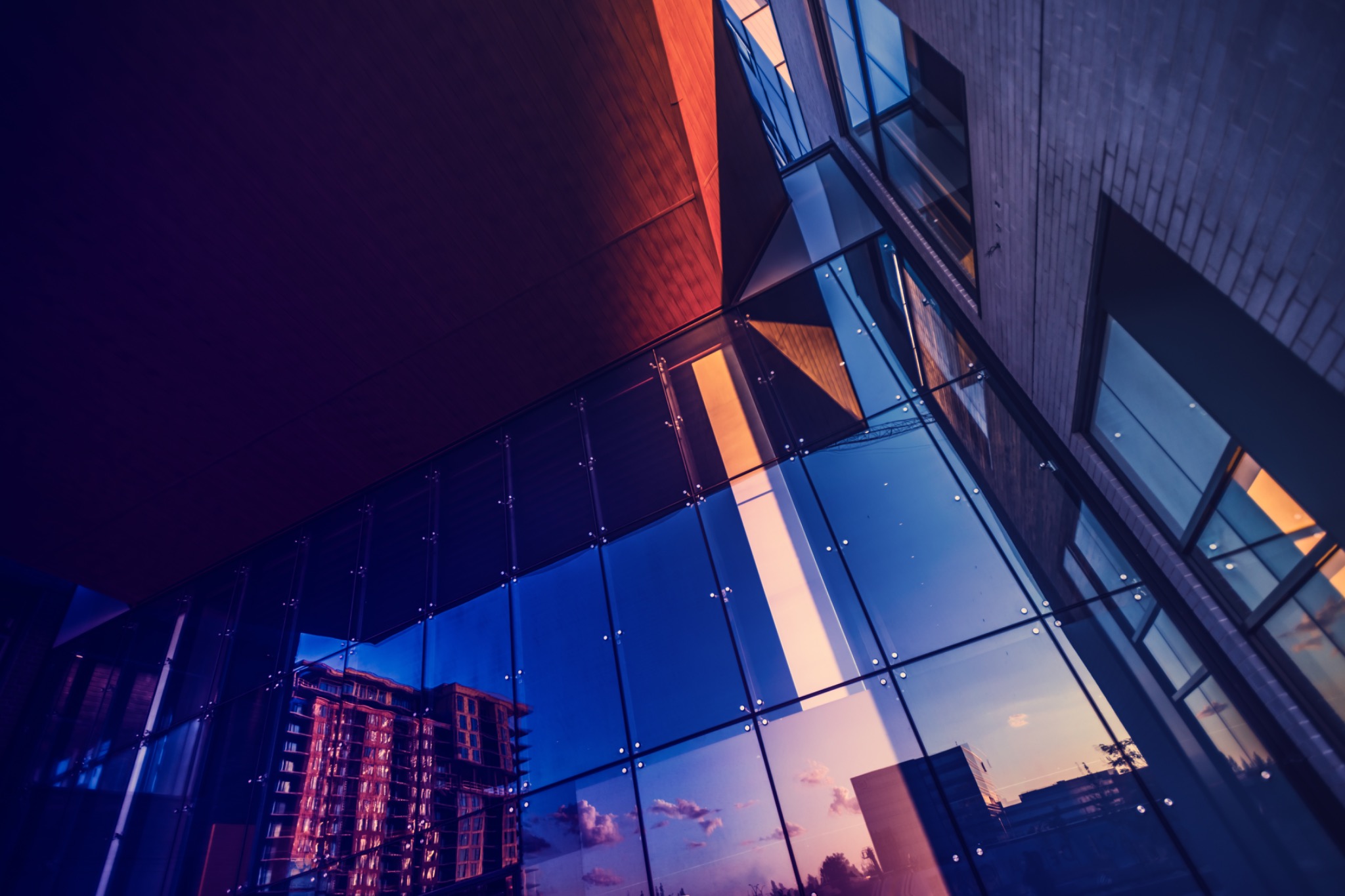 Modern glass building representing Solanique Estates real estate advisory.